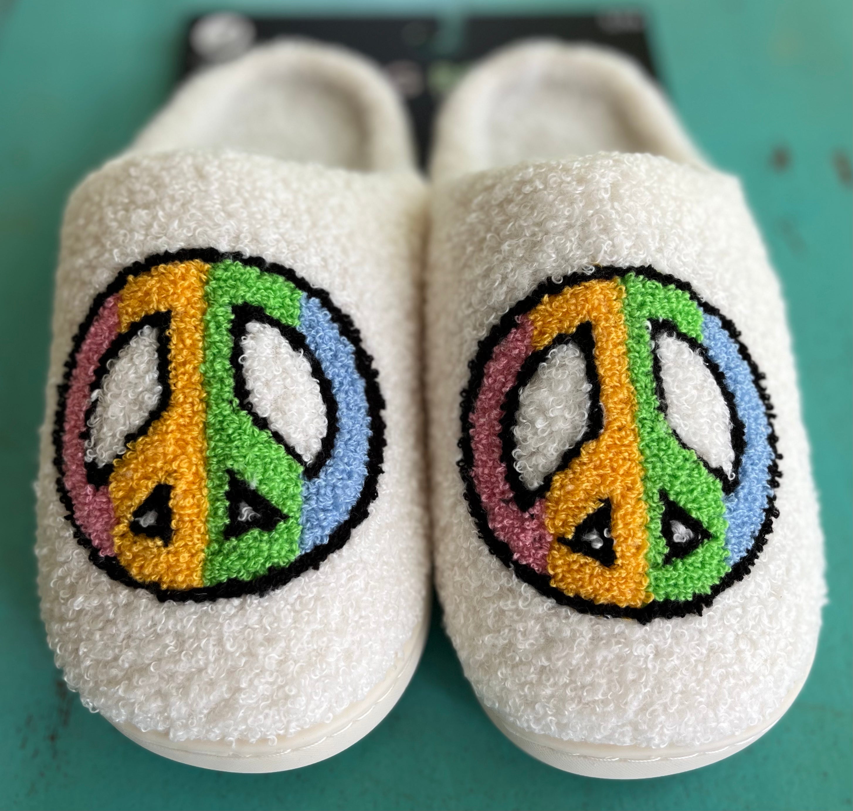 Living Royal Peace Slippers in soft, plush material with a cozy design, perfect for comfortable indoor wear.