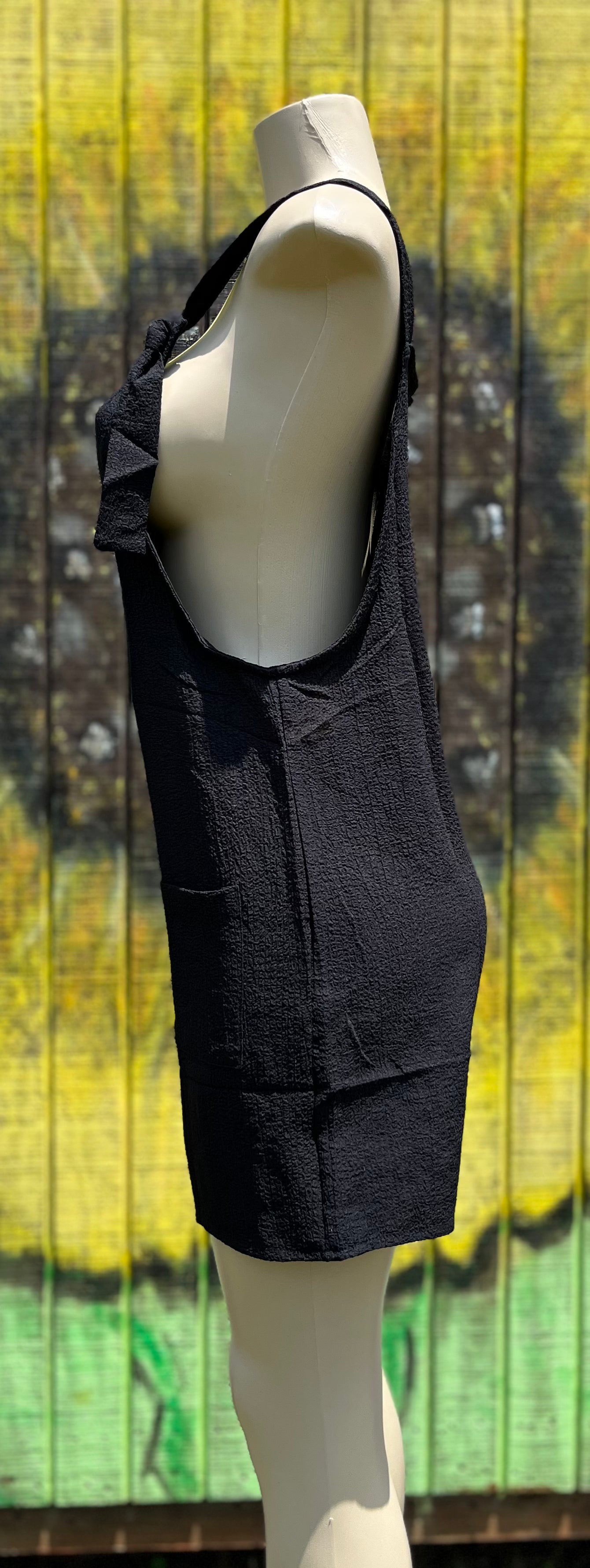 Black romper by Shiying Fashion featuring a stylish, sleeveless design with a fitted waist and casual chic look.
