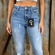 Pair of frayed hem flared jeans from Insane Gene USA showing distressed denim and high-waisted fit.