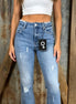 Pair of frayed hem flared jeans from Insane Gene USA showing distressed denim and high-waisted fit.
