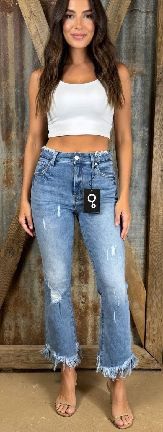 Pair of frayed hem flared jeans from Insane Gene USA showing distressed denim and high-waisted fit.