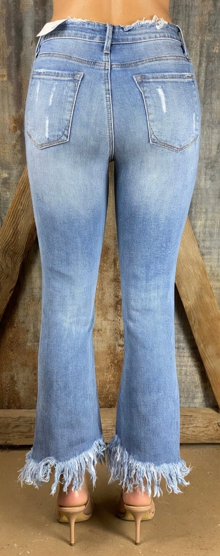 Pair of frayed flare jeans from Insane Gene USA featuring distressed, frayed hems and classic high-waisted style.