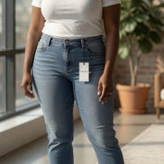 Light-wash Judy Blue Boyfriend Plus jeans with relaxed fit and distressed details, showcasing casual denim style.