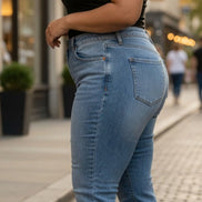 Light blue Judy Blue Boyfriend Plus jeans with relaxed fit, distressed details, and classic five-pocket design.