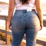 Light-wash Judy Blue Boyfriend Plus jeans showing relaxed fit, five-pocket design, and distressed details on denim.