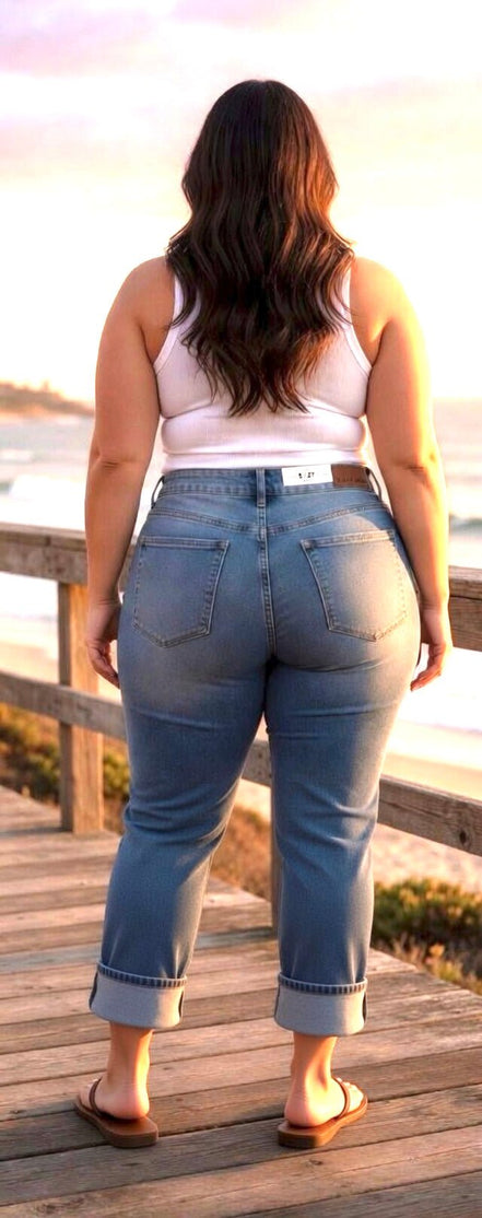 Light-wash Judy Blue Boyfriend Plus jeans showing relaxed fit, five-pocket design, and distressed details on denim.