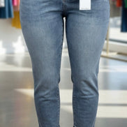 Light blue Judy Blue Boyfriend Plus jeans with relaxed fit and distressed details, shown on a model.