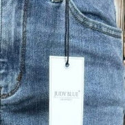 Light blue Judy Blue Boyfriend Plus jeans with relaxed fit and distressed details, showcasing casual and comfortable denim style.