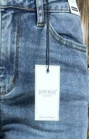 Light blue Judy Blue Boyfriend Plus jeans with relaxed fit and distressed details, showcasing casual and comfortable denim style.