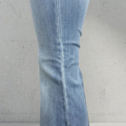 Judy Blue Flares featuring a high-waisted fit, classic denim wash, and flared leg style on a model showcasing casual denim fashion.