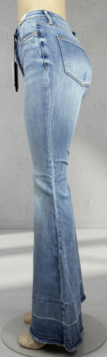 Judy Blue Flares featuring a high-waisted fit, classic denim wash, and flared leg style on a model showcasing casual denim fashion.
