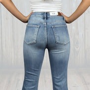 Judy Blue Flares jeans with high waist and wide-leg design, featuring classic denim wash and five-pocket style.