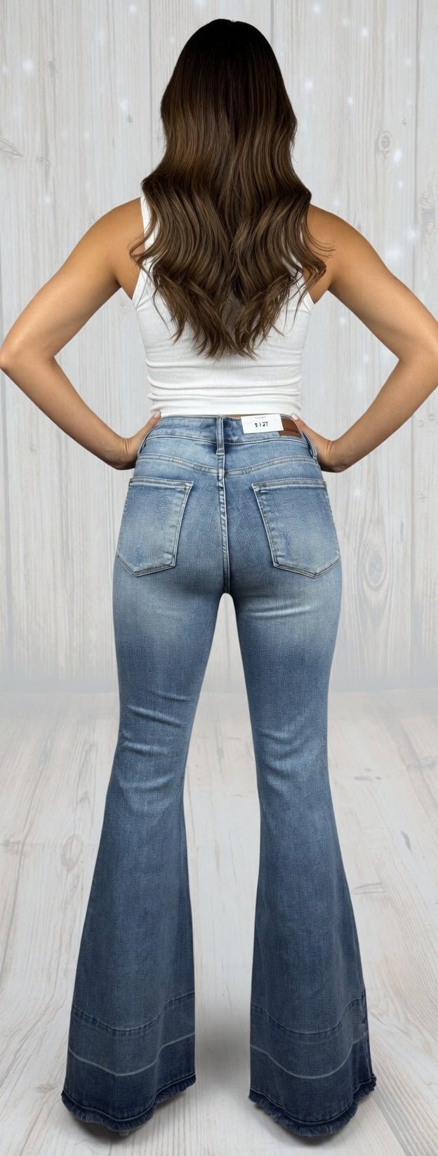 Judy Blue Flares jeans with high waist and wide-leg design, featuring classic denim wash and five-pocket style.