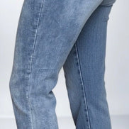 Judy Blue mid-rise release hem cropped bootcut jeans with distressed detailing and classic denim wash.