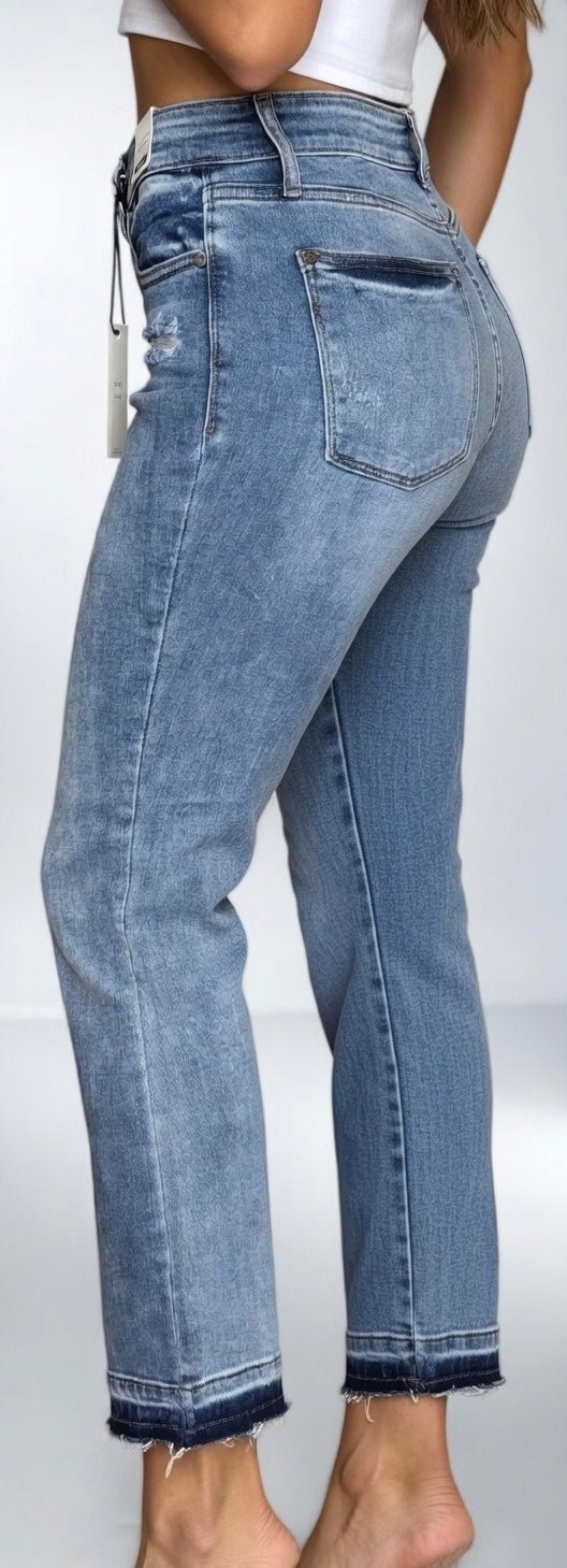 Judy Blue mid-rise release hem cropped bootcut jeans with distressed detailing and classic denim wash.