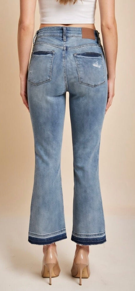 Judy Blue mid-rise release hem cropped bootcut jeans showcasing the stylish fit and distressed details.