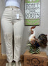 Light-colored Judy Blue Ecru Plus Jeans showing fit and denim texture on a model.