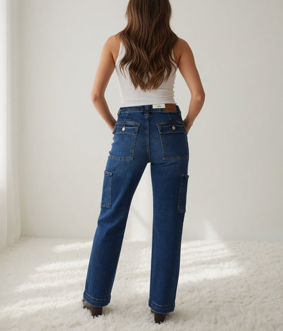 Pair of Judy Blue cargo jeans featuring multiple pockets, relaxed fit, and classic denim wash, showcasing casual streetwear style.