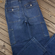 Judy Blue cargo jeans featuring multiple pockets and relaxed fit, made from durable denim fabric.