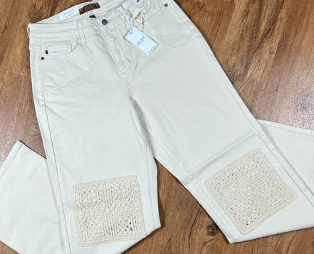 Ecru Judy Blue plus jeans shown on a model, featuring a classic fit with subtle fading and stitching details.