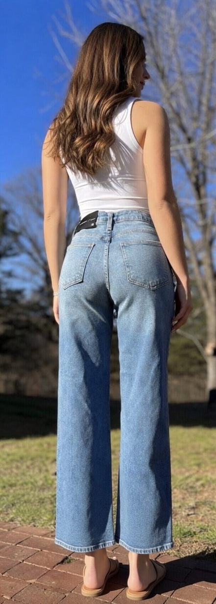 Light blue The Cool Dad Jean by Just Black Denim displayed on a mannequin, showcasing classic fit and stylish denim detailing.