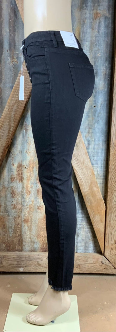 KanCan black high-rise skinny jeans shown on a model, featuring a fitted design and classic denim look.
