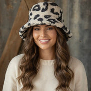 Beige and black leopard print bucket hat with wide brim, stylish accessory from La Plaza Mall.