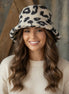 Beige and black leopard print bucket hat with wide brim, stylish accessory from La Plaza Mall.