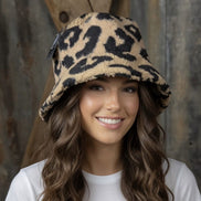 Tan and black leopard bucket hat by La Plaza Mall, featuring a stylish leopard print design perfect for casual wear.