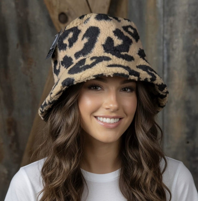 Tan and black leopard bucket hat by La Plaza Mall, featuring a stylish leopard print design perfect for casual wear.