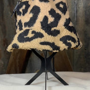 Tan and black leopard bucket hat from La Plaza Mall featuring stylish animal print fabric and a wide brim for sun protection.