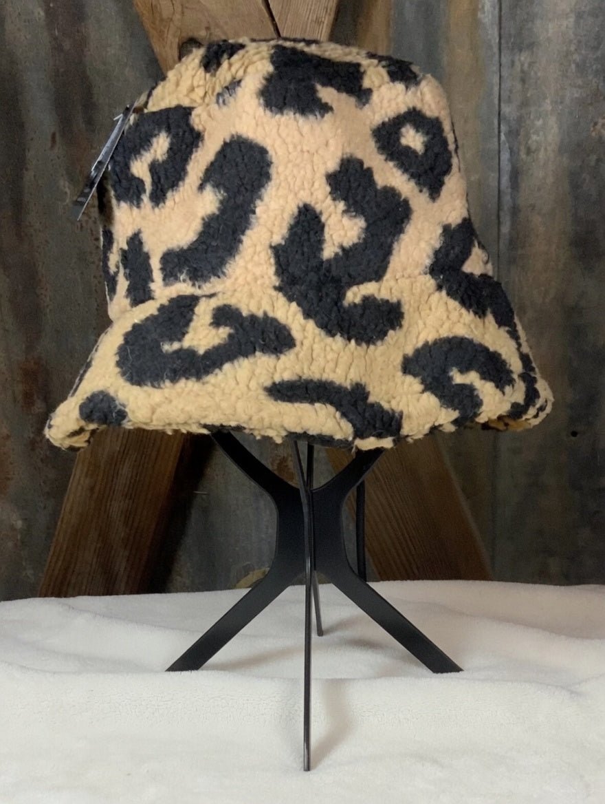 Tan and black leopard bucket hat from La Plaza Mall featuring stylish animal print fabric and a wide brim for sun protection.