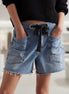 Mccolin lace-up denim shorts with distressed detailing, featuring a high-waisted fit and classic five-pocket design.