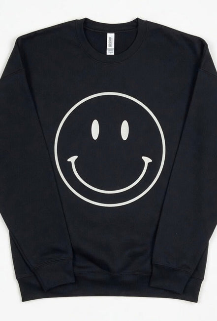 Oat Collective happy face sweatshirt featuring a colorful smiling face graphic on a cozy casual top.