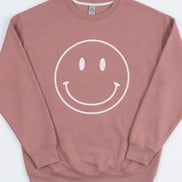 Oat Collective Happy Face sweatshirt, a cozy casual top with a playful smiley face design on soft fabric.