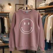 Oat Collective happy face sweatshirt, casual top featuring a cheerful face graphic on soft fabric, perfect for relaxed wear.