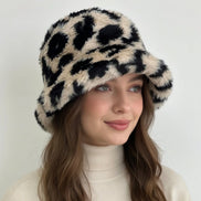 Leopard Sherpa Bucket Hat by Pink Irene Wholesale featuring a cozy sherpa lining and stylish leopard print design.