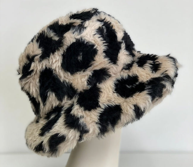 Leopard Sherpa Bucket Hat by Pink Irene Wholesale featuring a soft, cozy sherpa lining and stylish leopard print design.