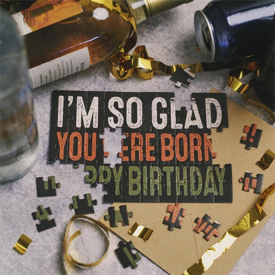 Questionables I'm So Glad Puzzle Card featuring colorful, artistic design with puzzle pieces and heartfelt message on a white background.