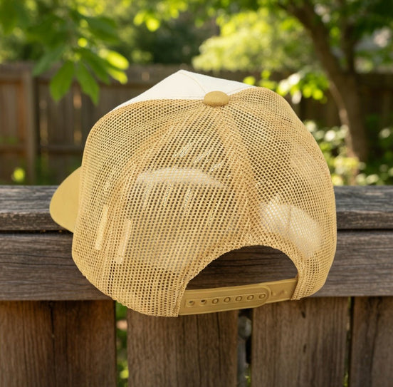 Questionables Kinda Shady Trucker Hat with mesh back and curved brim, featuring bold embroidered design on front panel.