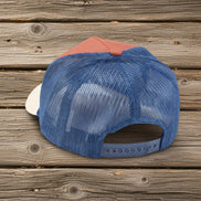 Questionables Not Bossy Trucker Hat with mesh back and curved brim, casual fashion accessory for outdoor wear.