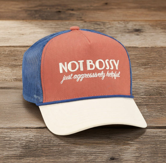 Questionables Not Bossy Trucker Hat featuring a classic mesh back and adjustable strap with bold front lettering.