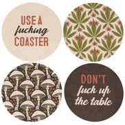 Set of four Questionables The Table coasters featuring stylish, absorbent cork surfaces with decorative designs.