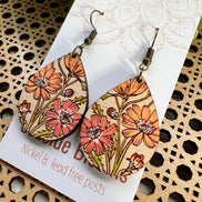 Hand-painted Boho Daisy Wood Earrings by Seasideblooms, lightweight earrings with floral design and natural wood texture.