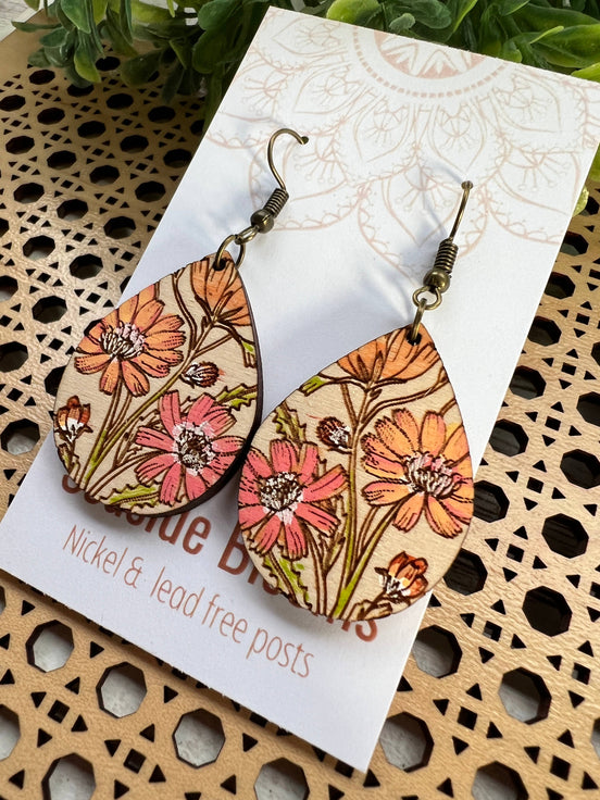 Hand-painted Boho Daisy Wood Earrings by Seasideblooms, lightweight earrings with floral design and natural wood texture.