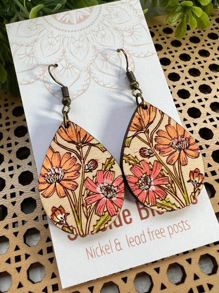 Hand-painted lightweight wooden earrings featuring boho daisy design by Seasideblooms