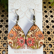 Hand-painted boho daisy wood earrings by Seasideblooms featuring lightweight, natural wood with floral design.