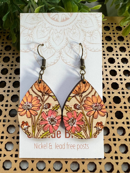Hand-painted boho daisy wood earrings by Seasideblooms featuring lightweight, natural wood with floral design.