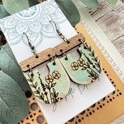 Lightweight boho maple wood earrings with hand-painted floral design by Seasideblooms, featuring natural wood texture and vibrant colors.