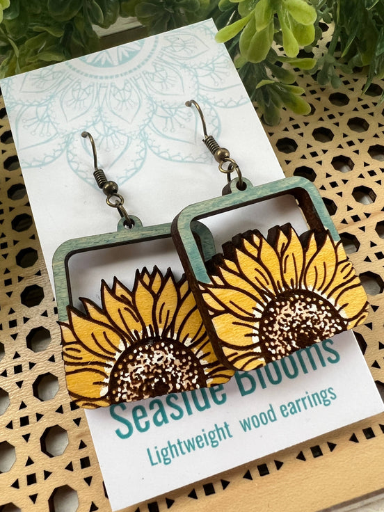 Hand-painted lightweight maple wood sunflower earrings from Seasideblooms in a boho style, featuring natural wood grain and floral design.